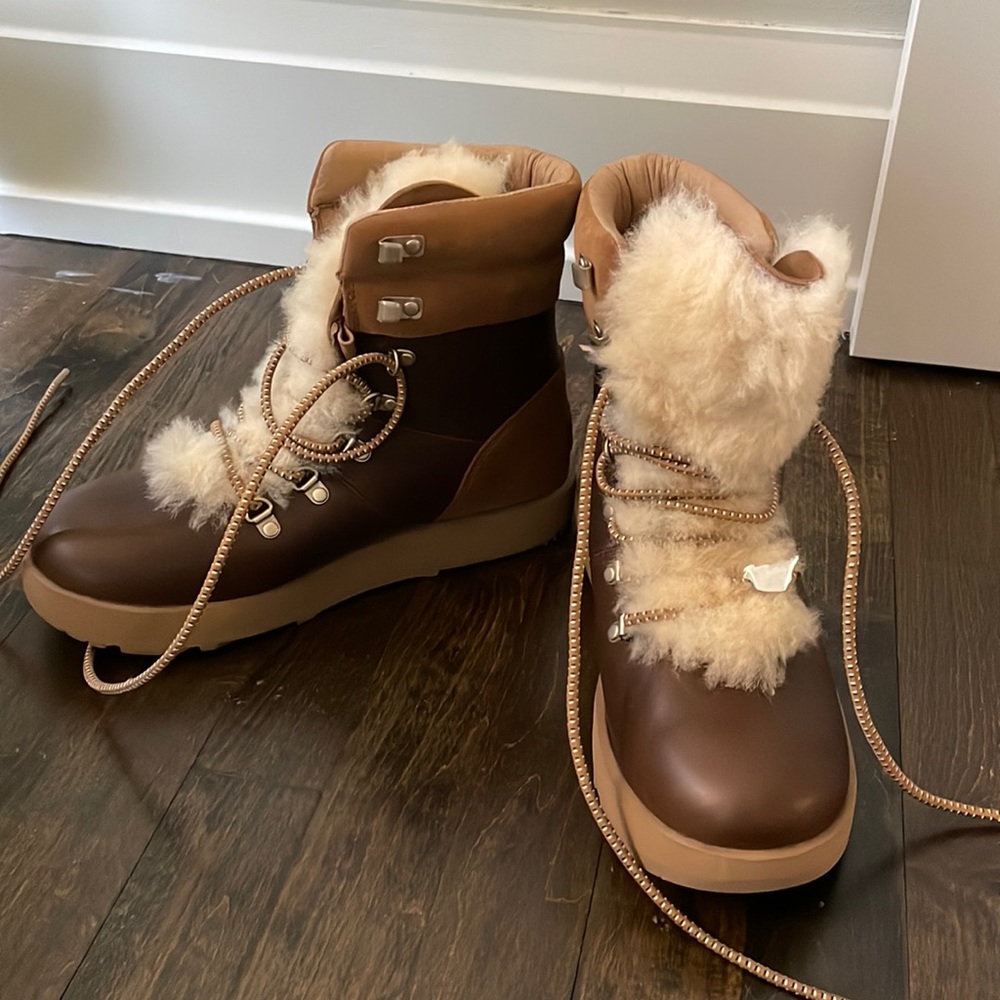 Size 8 Ugg Viki boots. New in box, never worn.